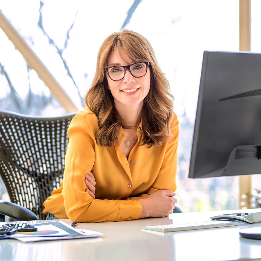 Woman sitting at her workstation